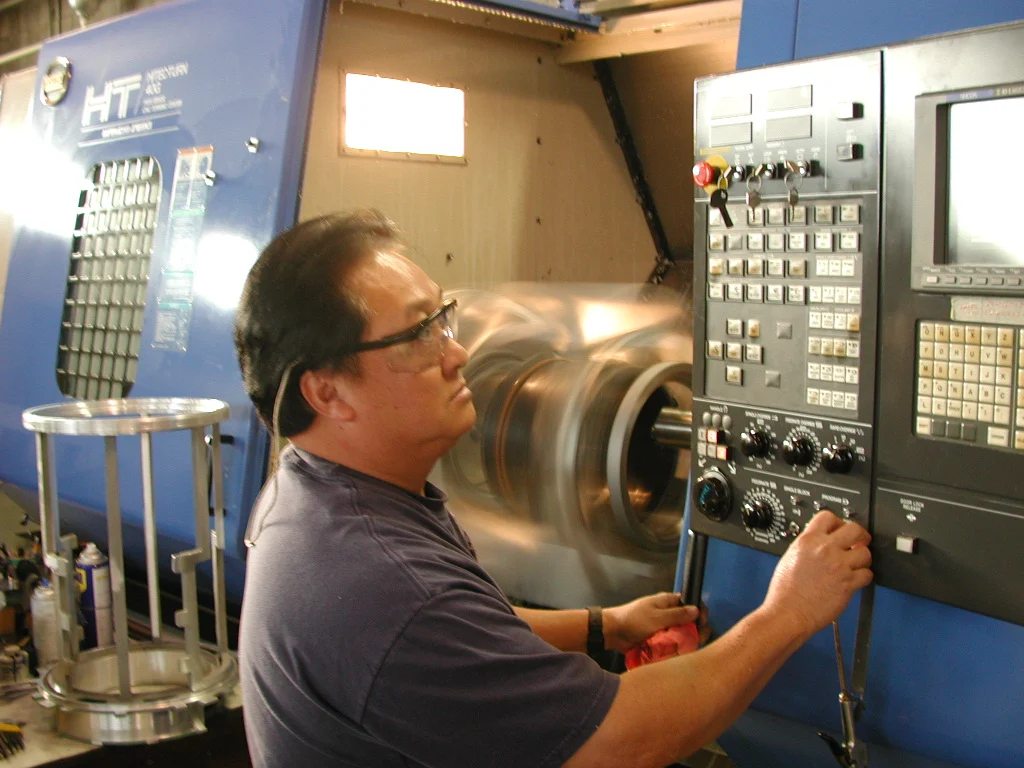 A Danko Arlington machinist operating CNC equipment